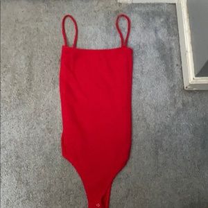Red body suit.